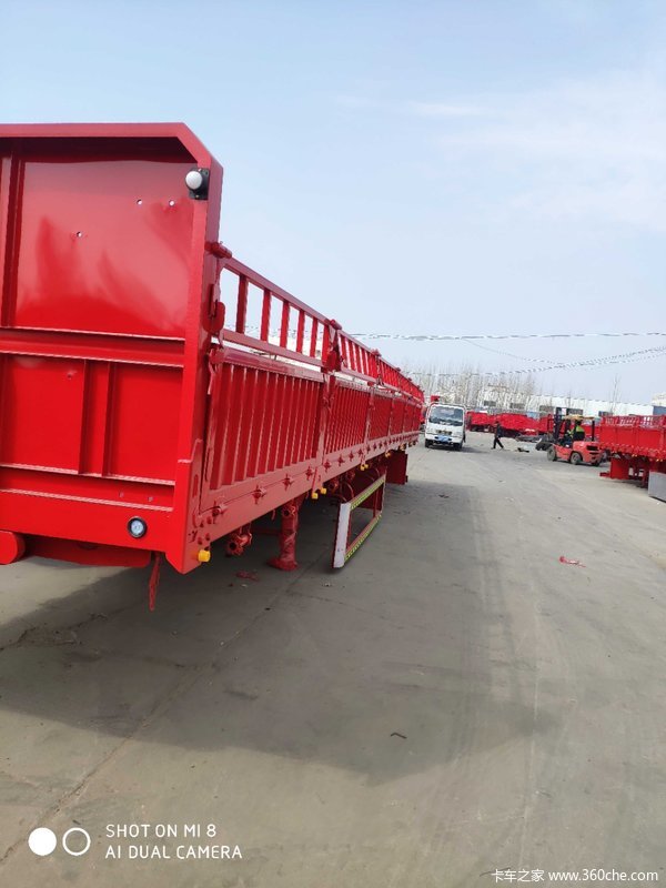 标箱侧翻自卸半挂车图片