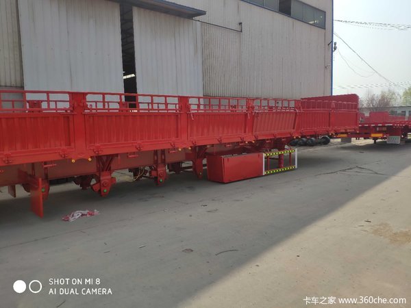 标箱侧翻自卸半挂车图片